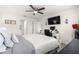 Inviting bedroom featuring a comfy bed, a ceiling fan, and a dedicated computer workspace with a desk at 8685 Sw 49Th Cir, Ocala, FL 34476