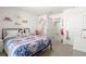 Comfortable bedroom featuring neutral carpet, and decor shelving at 8685 Sw 49Th Cir, Ocala, FL 34476