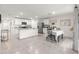 Spacious dining room featuring white cabinetry and stainless steel appliances with an open layout at 8685 Sw 49Th Cir, Ocala, FL 34476