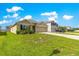 Well-maintained lawn of a one-story home with beautiful siding and a garage, alongside a two-story home at 8685 Sw 49Th Cir, Ocala, FL 34476