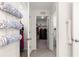 Bright hallway featuring easy access to a walk-in closet and bathroom at 8685 Sw 49Th Cir, Ocala, FL 34476