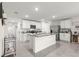Spacious kitchen with stainless steel appliances, an island, and granite countertops, offering ample room for cooking at 8685 Sw 49Th Cir, Ocala, FL 34476