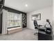 Office space includes a window, black accent wall and an executive desk at 8685 Sw 49Th Cir, Ocala, FL 34476