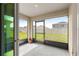 Enclosed patio offering an indoor-outdoor transition with views of the fenced yard and neighborhood at 8685 Sw 49Th Cir, Ocala, FL 34476