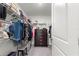 Organized walk-in closet with shelving, hanging racks, and a chest of drawers at 8685 Sw 49Th Cir, Ocala, FL 34476