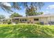 A lush green lawn and meticulously landscaped backyard offer a serene outdoor retreat at 9085 Sw 96Th Ln # B, Ocala, FL 34481
