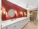Bathroom featuring an oversized countertop with dual sinks, tile flooring and modern lighting at 9085 Sw 96Th Ln # B, Ocala, FL 34481