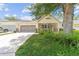 Inviting single-story home with a well-maintained lawn and a two car garage at 9085 Sw 96Th Ln # B, Ocala, FL 34481