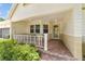 Inviting front porch with tile flooring and a covered entryway at 9085 Sw 96Th Ln # B, Ocala, FL 34481