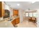 Functional kitchen with ample countertop space, natural lighting, tile flooring, and oak cabinets at 9085 Sw 96Th Ln # B, Ocala, FL 34481