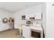 Utility room with washer, dryer, sink, water heater, and ample storage cabinets at 9085 Sw 96Th Ln # B, Ocala, FL 34481