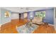 An open concept living room with hardwood floors, natural lighting, and comfortable seating arrangement at 9085 Sw 96Th Ln # B, Ocala, FL 34481