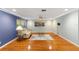 Spacious living room showcasing wood floors, recessed lighting, and a relaxing atmosphere at 9085 Sw 96Th Ln # B, Ocala, FL 34481