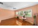 Inviting living room with wood flooring, ample natural light, and a ceiling fan at 9085 Sw 96Th Ln # B, Ocala, FL 34481
