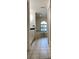 Bathroom showcases tiled floor, vanity, garden tub and arched window for natural light at 9923 Se 64Th Ave, Belleview, FL 34420