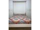 Bedroom with a built-in bed with colorful quilt and surrounding wardrobe at 9923 Se 64Th Ave, Belleview, FL 34420