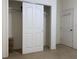 Bedroom closet with sliding doors and wire shelving offers ample storage space at 9923 Se 64Th Ave, Belleview, FL 34420