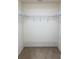 Walk-in closet features carpet flooring and organized shelving at 9923 Se 64Th Ave, Belleview, FL 34420
