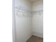 Walk-in closet features carpet flooring and organized shelving at 9923 Se 64Th Ave, Belleview, FL 34420