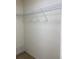 Walk-in closet features carpet flooring and organized shelving at 9923 Se 64Th Ave, Belleview, FL 34420