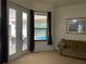 Inviting living room area leading to outdoor spaces and pool view at 9923 Se 64Th Ave, Belleview, FL 34420
