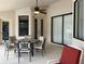 Covered patio featuring seating and providing ample space for entertaining at 9923 Se 64Th Ave, Belleview, FL 34420