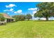 Lush backyard with mature trees; ample space with scenic home view at 9925 Sw 95Th Loop, Ocala, FL 34481