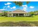 Manicured backyard view highlighting the home's outdoor living and landscaping at 9925 Sw 95Th Loop, Ocala, FL 34481