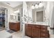Spacious bathroom featuring double vanities and a walk-in closet at 9925 Sw 95Th Loop, Ocala, FL 34481