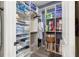 Organized walk-in closet with shelving for clothing, towels, and storage containers at 9925 Sw 95Th Loop, Ocala, FL 34481