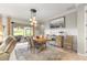Elegant dining area with stylish lighting and a view of the patio at 9925 Sw 95Th Loop, Ocala, FL 34481