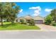 Charming one-story home with well-maintained lawn, mature trees and beautiful landscaping at 9925 Sw 95Th Loop, Ocala, FL 34481