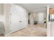 Bright hallway with tiled floors and multiple access doors at 9925 Sw 95Th Loop, Ocala, FL 34481