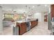 Open-concept kitchen with granite countertops and stainless steel appliances at 9925 Sw 95Th Loop, Ocala, FL 34481