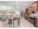 Modern kitchen with stainless steel appliances and a center island with bar stool seating at 9925 Sw 95Th Loop, Ocala, FL 34481