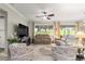 Comfortable seating arrangement in the living room with a large television at 9925 Sw 95Th Loop, Ocala, FL 34481