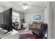 Well-organized office space with a desk, comfortable seating, and natural light from the window at 9925 Sw 95Th Loop, Ocala, FL 34481