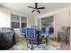 Outdoor patio area complete with ceiling fan, comfortable furniture, and a view of the backyard at 9925 Sw 95Th Loop, Ocala, FL 34481