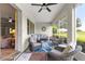 Inviting screened porch with comfortable seating and a view of the lawn at 9925 Sw 95Th Loop, Ocala, FL 34481