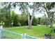 Expansive backyard with well-maintained lawn and mature trees for privacy at 8896 Sw 116Th Place Rd, Ocala, FL 34481