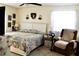 Bright bedroom with decorative accents, featuring a cozy chair and carpeted floor at 8896 Sw 116Th Place Rd, Ocala, FL 34481
