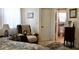 Bright bedroom with an adjacent bathroom featuring a toilet and cabinet space at 8896 Sw 116Th Place Rd, Ocala, FL 34481