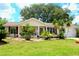 Charming single-story home featuring a well-manicured lawn and nicely landscaped front yard at 8896 Sw 116Th Place Rd, Ocala, FL 34481