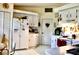 Functional kitchen with white cabinetry, essential appliances, and plenty of counter space for meal preparation at 8896 Sw 116Th Place Rd, Ocala, FL 34481