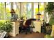 Bright office space in the sunroom with a desk, computer, and natural light at 8896 Sw 116Th Place Rd, Ocala, FL 34481