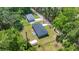 Aerial view of property showing home, adjacent house, and surrounding wooded area at 1133 Nw 122Nd Pl, Citra, FL 32113