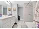 Bathroom featuring a white vanity, quartz countertop, framed art and a walk-in shower at 1133 Nw 122Nd Pl, Citra, FL 32113