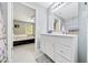 Light and airy bathroom leading to a bedroom with fresh paint, modern fixtures, and neutral decor at 1133 Nw 122Nd Pl, Citra, FL 32113