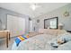 Well-lit bedroom with tile flooring, ceiling fan, closet space and neutral paint for easy personalization at 1133 Nw 122Nd Pl, Citra, FL 32113