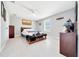 Bedroom featuring a ceiling fan, new floors, and modern fixtures showcasing a clean, updated space at 1133 Nw 122Nd Pl, Citra, FL 32113